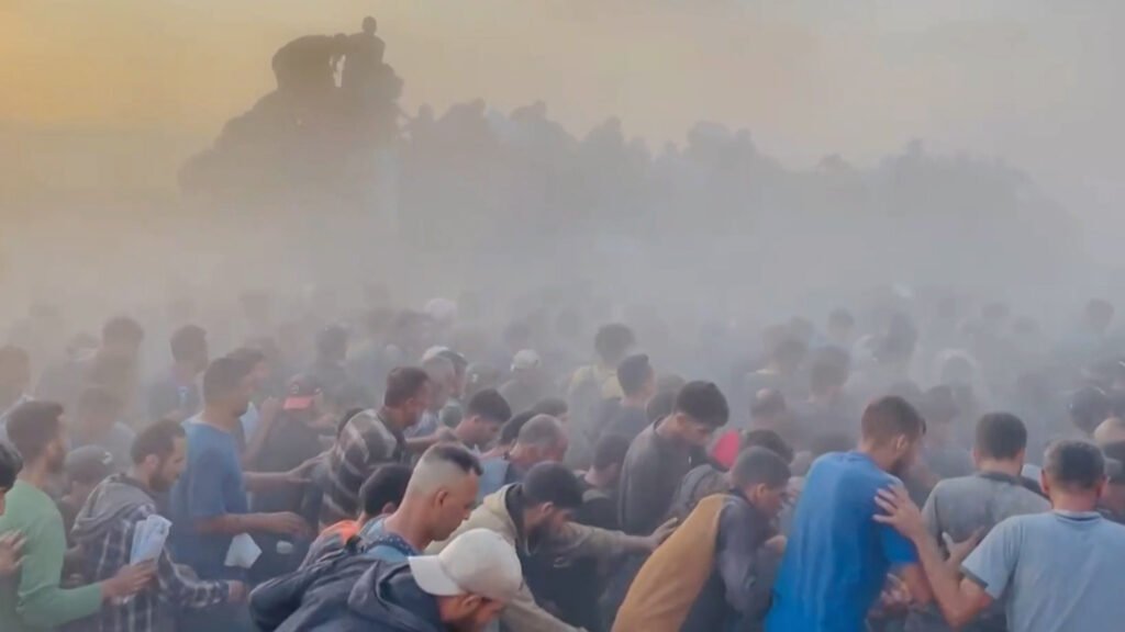 Chaotic scenes as desperately-hungry Palestinians scramble for aid in Gaza