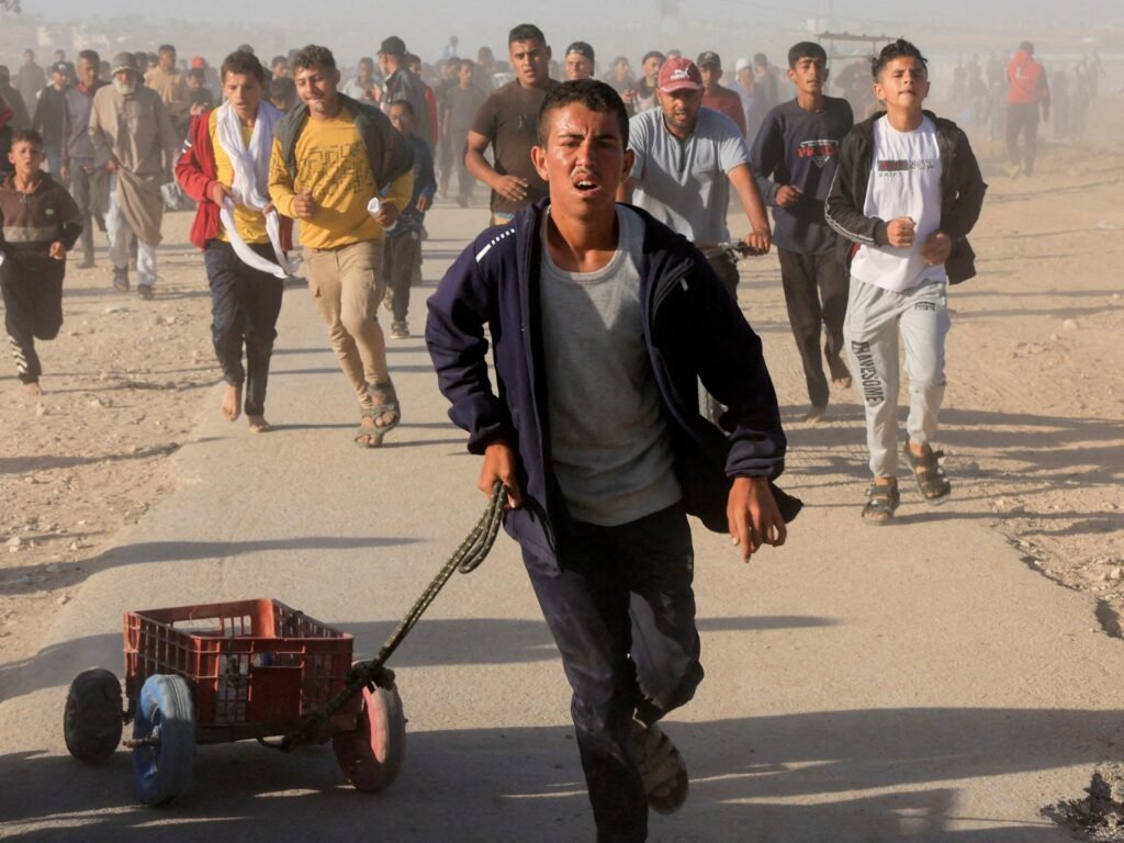 Starving Palestinians pepper-sprayed at GHF aid site in Gaza, video shows | Israel-Palestine conflict News