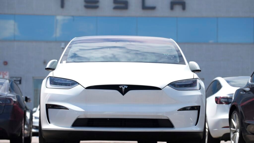 Tesla profits slide 16%, despite Elon Musk’s pivot back to his companies : NPR